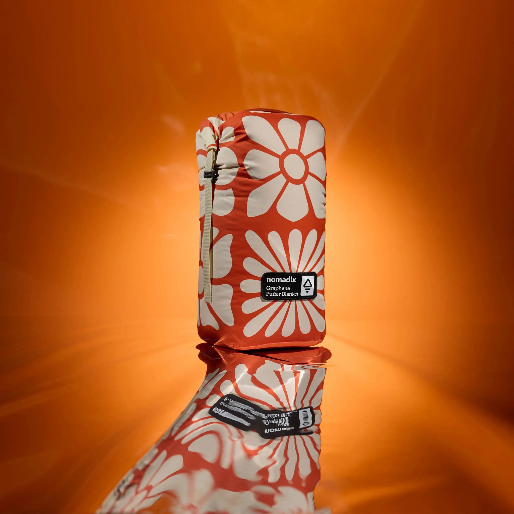 Nomadix | Graphene Puffer Blanket: Big Flowers Expedition Orange